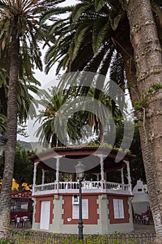 Music kiosk between palm trees photo