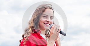 Music and life. teen girl singing song with microphone. having a party. Happy kid with microphone. karaoke concept