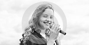 Music and life. teen girl singing song with microphone. having a party. Happy kid with microphone. karaoke concept