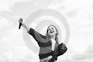 Music and life. teen girl singing song with microphone. having a party. Happy kid with microphone. Singing Songs in