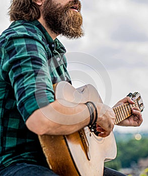 Music lifestyle man playing guitar nature concept. Hands of man musician playing guitar. Acoustic guitars playing. Music