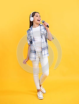 music lifestyle. sing a music song. young singer singing in mic. teen girl having fun at karaoke. girl singing karaoke
