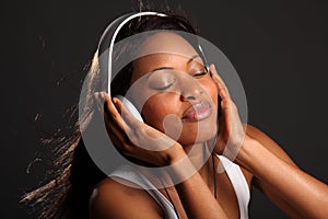 Music lover eyes closed listening on headphones