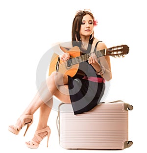 Music lover, summer girl with guitar and suitcase