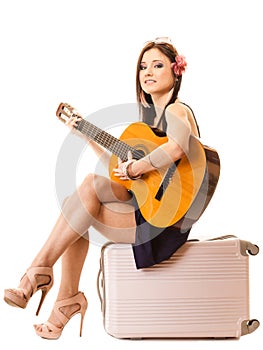Music lover, summer girl with guitar and suitcase