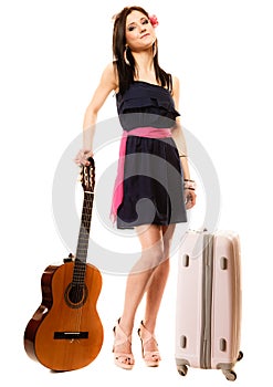 Music lover, summer girl with guitar and suitcase