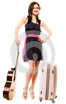 Music lover, summer girl with guitar and suitcase