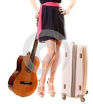 Music lover, summer girl with guitar and suitcase
