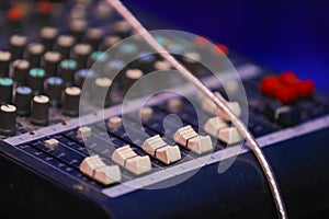 Music mixer control panel. Closeup
