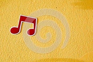 Music note plastic sticker on colorful cement wall