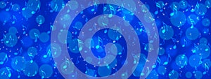 Music Notes, Bokeh and Sparkles in Blue Background Banner