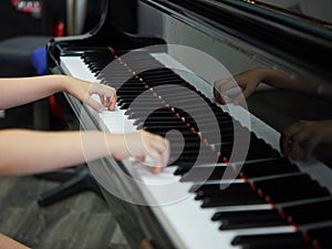 Music performer& x27;s hand playing the piano