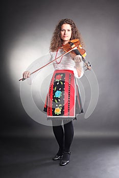 Music performer with violin in Bulgarian costume