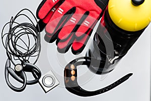 Music player, sport watch, a bottle and hand gloves