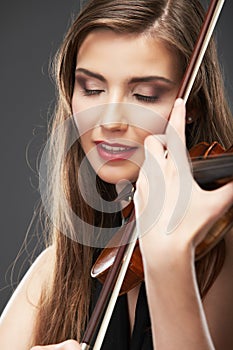 Music portrait of young woman. Violin play.