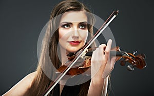 Music portrait of young woman. Violin play.