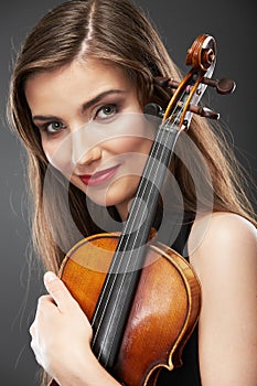 Music portrait of young woman. Violin play.