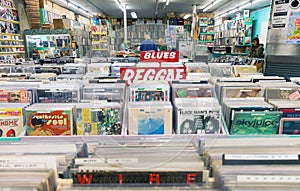 Music record shop interior with racks full of vintage vinyl records