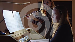 Music rehearsal - flutist and organist playing music