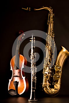 Music Sax tenor saxophone violin and clarinet in black photo