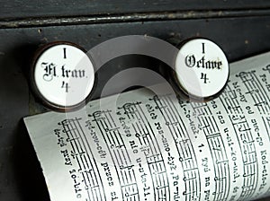 Music sheet page on the top of a church organ