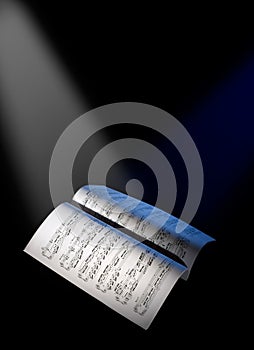 Music sheets under the reflector lights