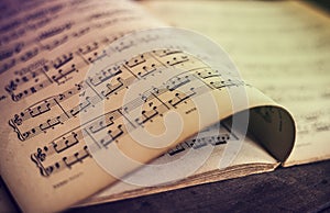 Music sheets on wooden background