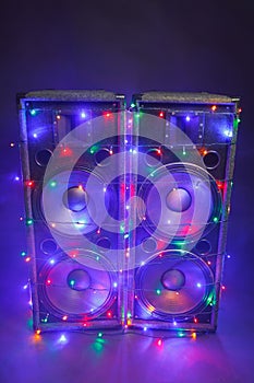 Music speakers with festive Christmas lights and smoke