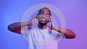 Music Streaming Services. Portraif Of Smiling Black Guy In Wireless Headphones