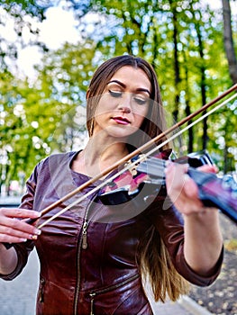 Music street performers with girl violinist