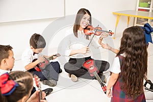 Woman teaching music in preschool