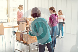 Music teacher with students in class on the xylophone