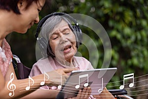 Music therapy in dementia treatment on elderly woman