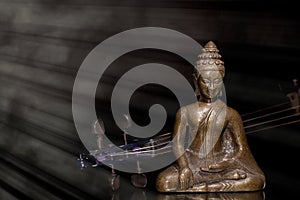 Music therapy. Spiritual, New Age, and religious music. Bronze buddha meditatin