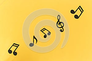 Musical background. notes on a yellow background.