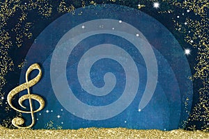 Music backgrounds.Treble clef on golden glitter on blue background and glitter frame with blank space to write text