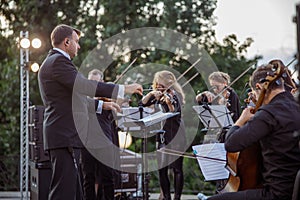 Musical ensemble playing classic instrumental music outdoors