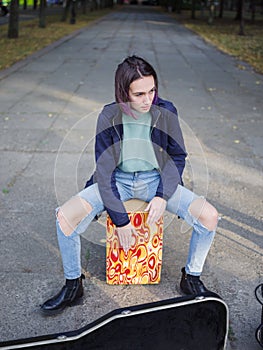 The musical group performs compositions on the street in the park on a natural background. photo