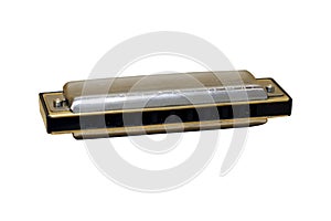 Musical harmonica is isolated on the white background