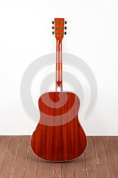 Musical instrument - back view acoustic guitar wood and white background