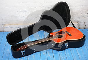 Musical instrument - Orange acoustic guitar in hard case