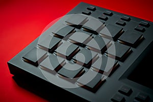 Musical instrument, sampler on a red background