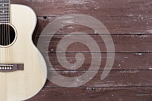 Musical instrument - Silhouette of a spruce top left handed acoustic guitar on wooden