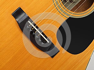 Musical instrument - Top view pickguard, bridge, pins and strings acoustic guitar