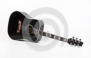 Musical instrument - vintage black acoustic guitar white background