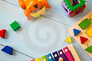Musical instruments baby toyson wooden background. copy space, place for your text or slogan. Top view