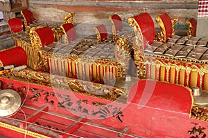 Musical instruments in a Hindu temple on Bali island, Indonesia. Gamelan or gamelang is a musical instrument that is played using