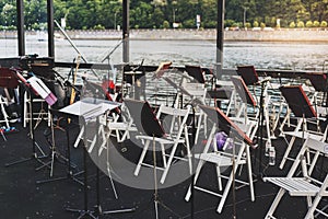 Musical instruments on the river bank in warm summer evening