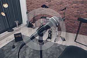 Musical instruments in studio, focus on microphone