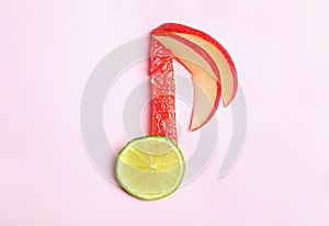 Musical note made of fruits on color background